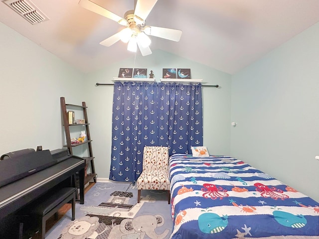 bedroom with lofted ceiling and a ceiling fan
