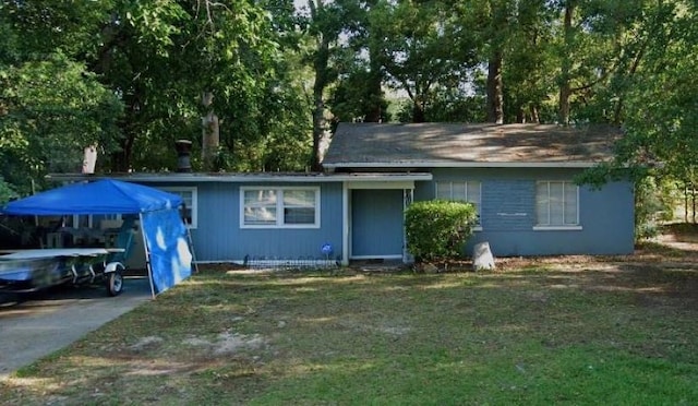 ranch-style house with a front lawn