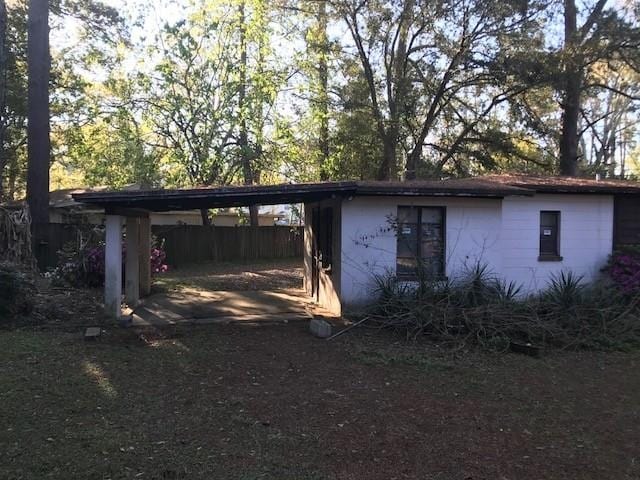 view of outbuilding featuring a carport