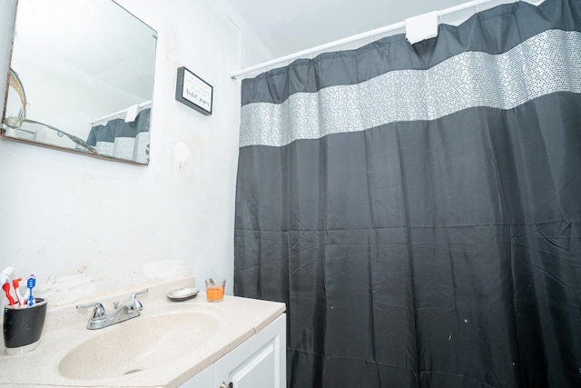 bathroom with crown molding and vanity