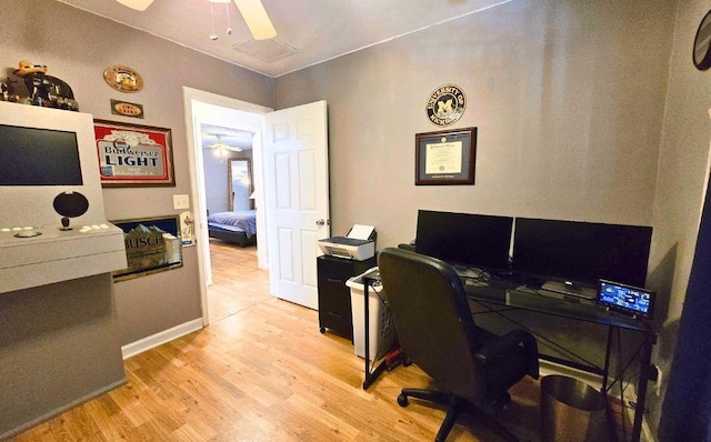 office space with ceiling fan and light wood-type flooring