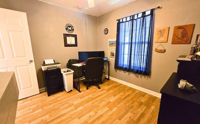 office with ceiling fan and light wood-type flooring