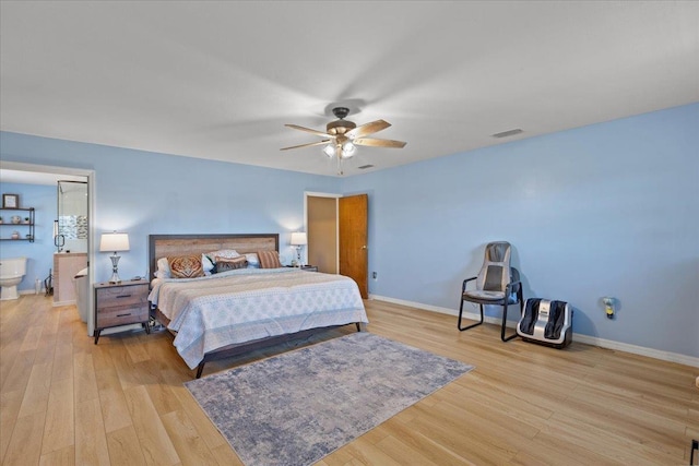 bedroom with visible vents, baseboards, ensuite bath, light wood-style flooring, and ceiling fan