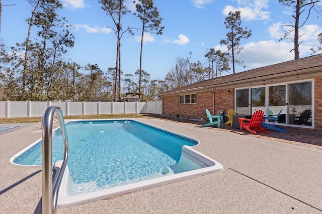 view of swimming pool with a patio area, a fenced backyard, and a fenced in pool