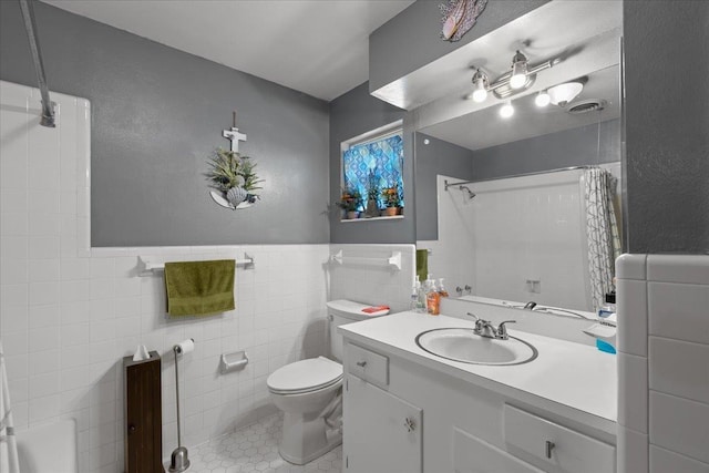 full bathroom with toilet, visible vents, vanity, tile walls, and a shower with curtain