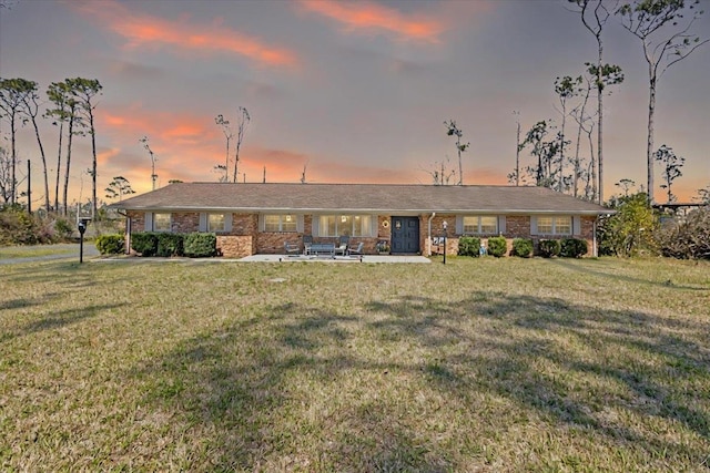 single story home featuring a patio area and a front yard