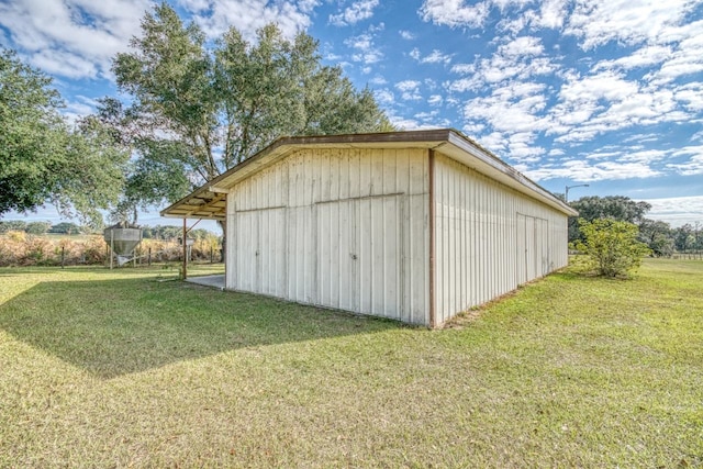 view of outdoor structure with a yard