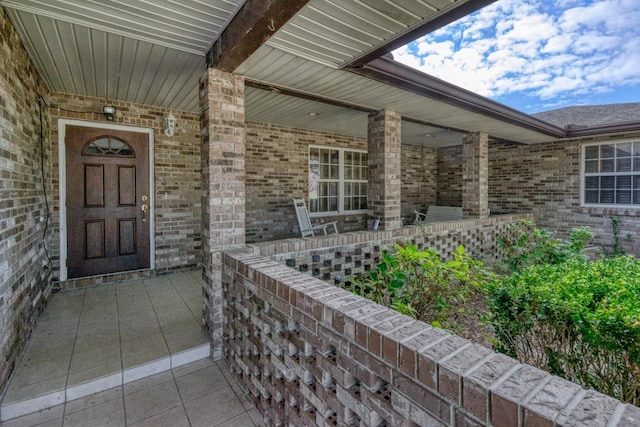 property entrance featuring covered porch