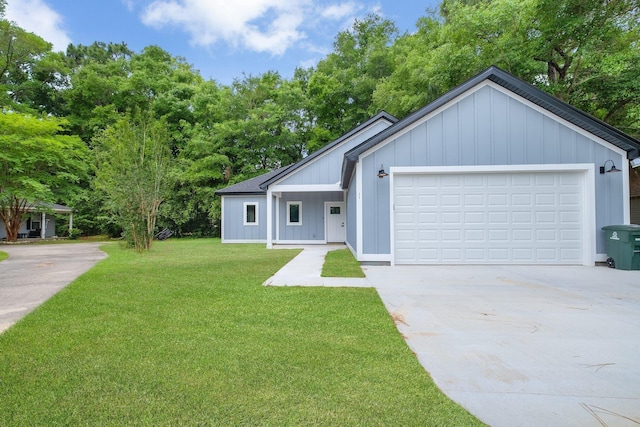 279 Ayers Ct, Tallahassee, FL 32305 - view of front of home with a front lawn, concrete driveway, and a garage