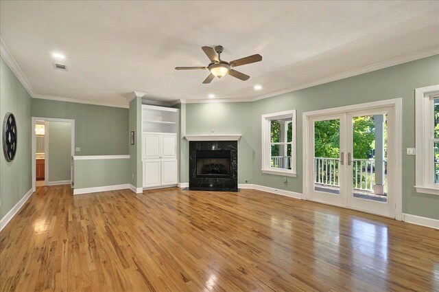 9078 Shoal Creek Dr, Tallahassee, FL 32312 - unfurnished living room with wood finished floors, a ceiling fan, crown molding, a fireplace, and baseboards