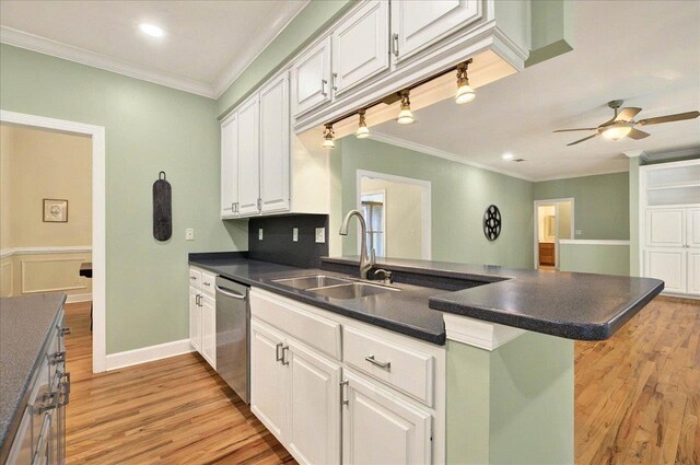 9078 Shoal Creek Dr, Tallahassee, FL 32312 - kitchen with a sink, dishwasher, a peninsula, ornamental molding, and light wood-type flooring