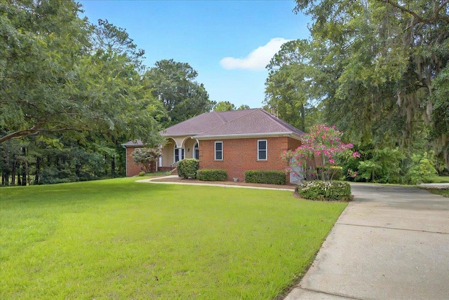 9078 Shoal Creek Dr, Tallahassee, FL 32312 - view of front of home with a front lawn and brick siding