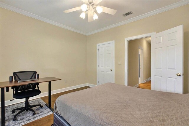9078 Shoal Creek Dr, Tallahassee, FL 32312 - bedroom with wood finished floors, ornamental molding, baseboards, an office area, and a ceiling fan