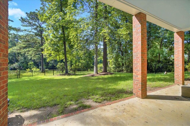 9078 Shoal Creek Dr, Tallahassee, FL 32312 - view of yard with a patio and view of wooded area