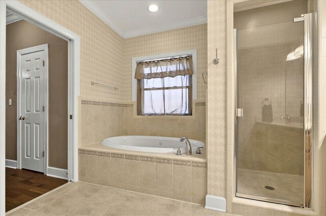9078 Shoal Creek Dr, Tallahassee, FL 32312 - full bathroom featuring crown molding, a garden tub, a shower stall, tile patterned floors, and wallpapered walls