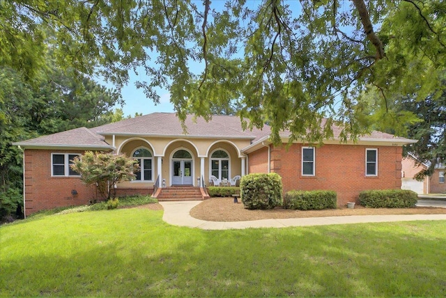 9078 Shoal Creek Dr, Tallahassee, FL 32312 - ranch-style home featuring a front yard, brick siding, and french doors