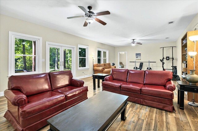 9078 Shoal Creek Dr, Tallahassee, FL 32312 - living area featuring a ceiling fan, wood finished floors, and baseboards