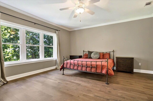 9078 Shoal Creek Dr, Tallahassee, FL 32312 - bedroom featuring baseboards, wood finished floors, crown molding, and ceiling fan