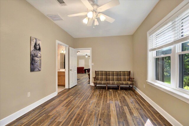 9078 Shoal Creek Dr, Tallahassee, FL 32312 - sitting room with ceiling fan, dark wood finished floors, and baseboards