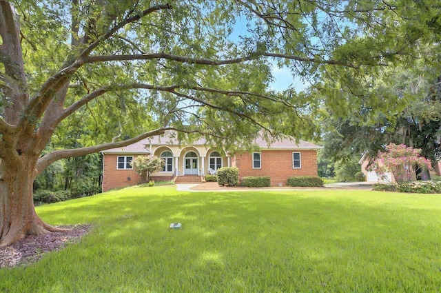 9078 Shoal Creek Dr, Tallahassee, FL 32312 - ranch-style home with a front yard and brick siding