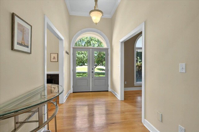 9078 Shoal Creek Dr, Tallahassee, FL 32312 - foyer with crown molding, light wood-type flooring, french doors, and baseboards
