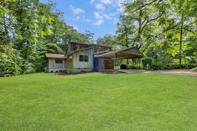 988 Timber Run, Havana, FL 32333 - back of house with a carport, a lawn, and driveway