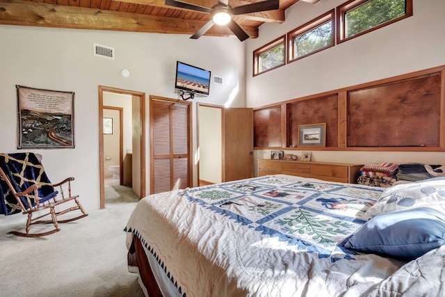 988 Timber Run, Havana, FL 32333 - bedroom featuring high vaulted ceiling, light colored carpet, wooden ceiling with exposed beams, connected bathroom, and a closet