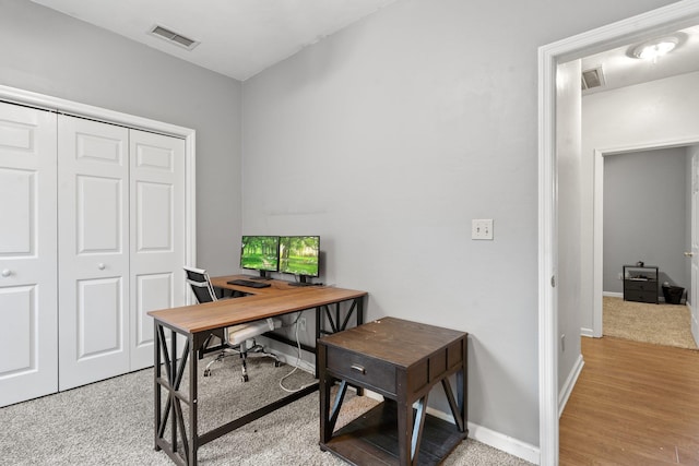 office area with light hardwood / wood-style flooring