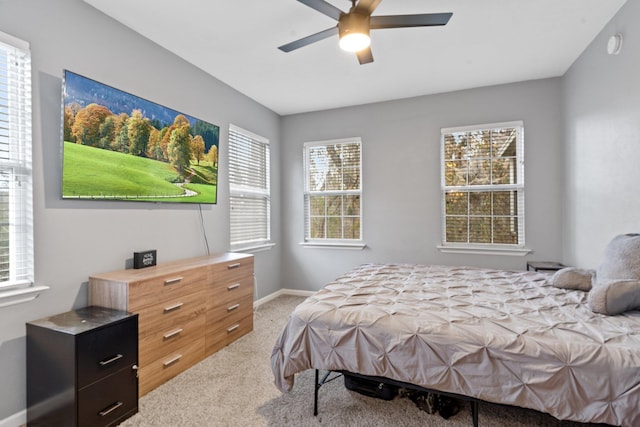 bedroom with light colored carpet and ceiling fan