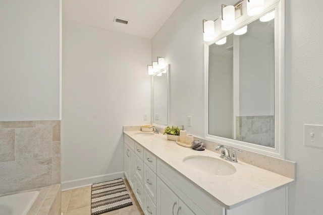4468 River Breeze Ln, Tallahassee, FL 32303 - bathroom with double vanity and a tub