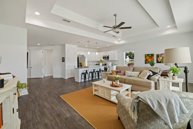 4468 River Breeze Ln, Tallahassee, FL 32303 - living room with a raised ceiling, ceiling fan, recessed lighting, dark wood finished floors, and baseboards