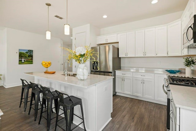 4468 River Breeze Ln, Tallahassee, FL 32303 - kitchen featuring appliances with stainless steel finishes, dark wood-style floors, a sink, white cabinets, and recessed lighting