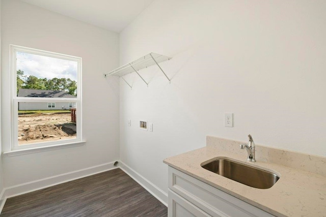 4468 River Breeze Ln, Tallahassee, FL 32303 - laundry area with hookup for a washing machine, dark wood finished floors, baseboards, and cabinet space