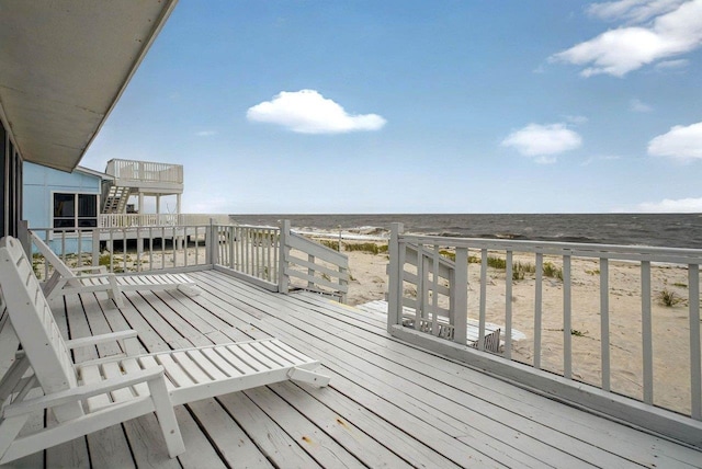 1195 Alligator Dr, Alligator Point, FL 32346 - wooden deck with view of water and beach