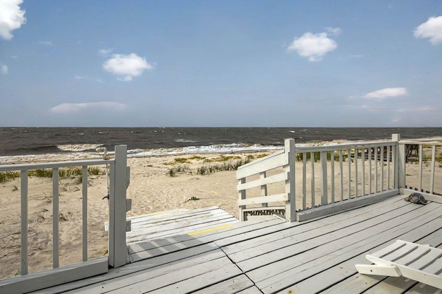 1195 Alligator Dr, Alligator Point, FL 32346 - wooden deck with view of water and beach