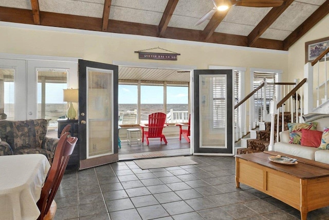 1195 Alligator Dr, Alligator Point, FL 32346 - living area featuring french doors, a ceiling fan, dark tile patterned flooring, and stairway