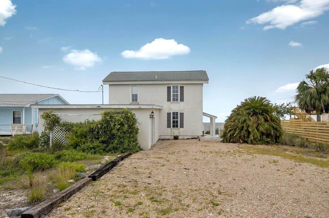 1195 Alligator Dr, Alligator Point, FL 32346 - rear view of property featuring fence and stucco siding