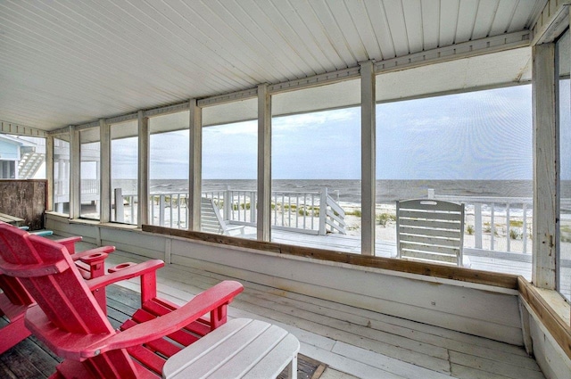 1195 Alligator Dr, Alligator Point, FL 32346 - sunroom / solarium featuring view of water and beach and healthy amount of natural light