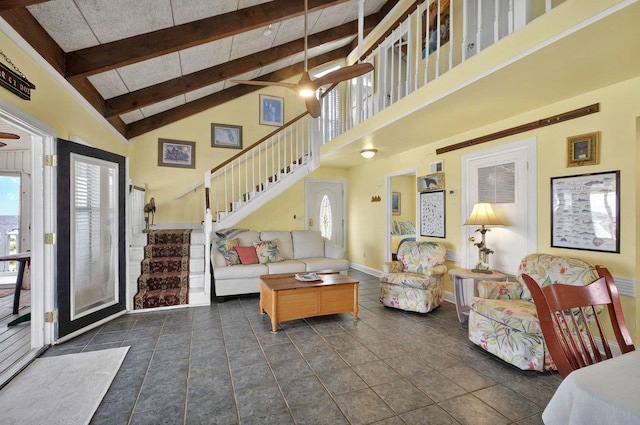 1195 Alligator Dr, Alligator Point, FL 32346 - living room featuring high vaulted ceiling, stairs, baseboards, and beamed ceiling