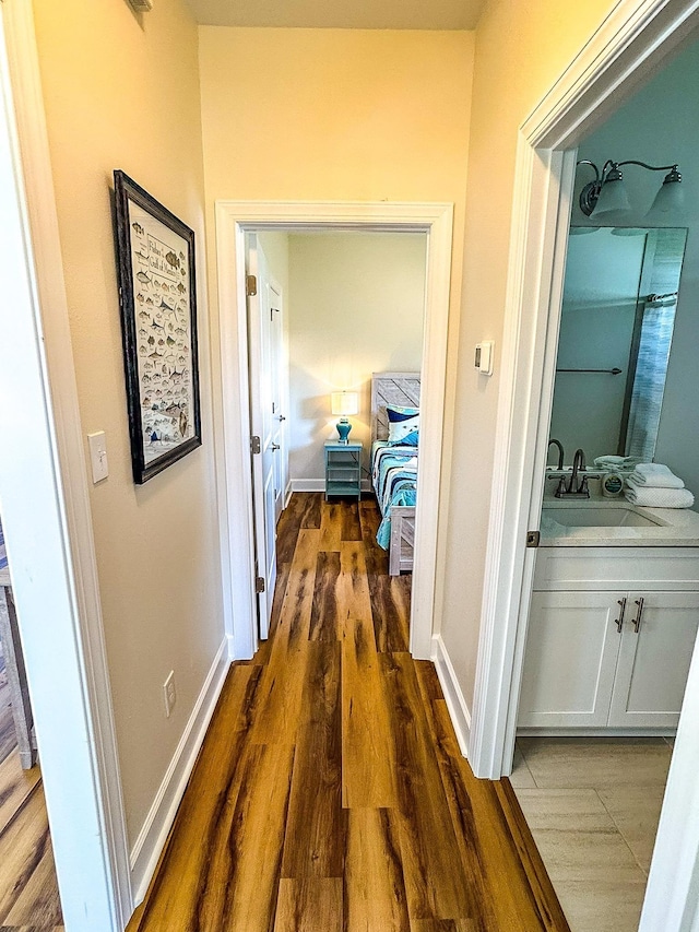254 Ante Beppum Loop, Carrabelle, FL 32322 - corridor with a sink and dark wood-style floors