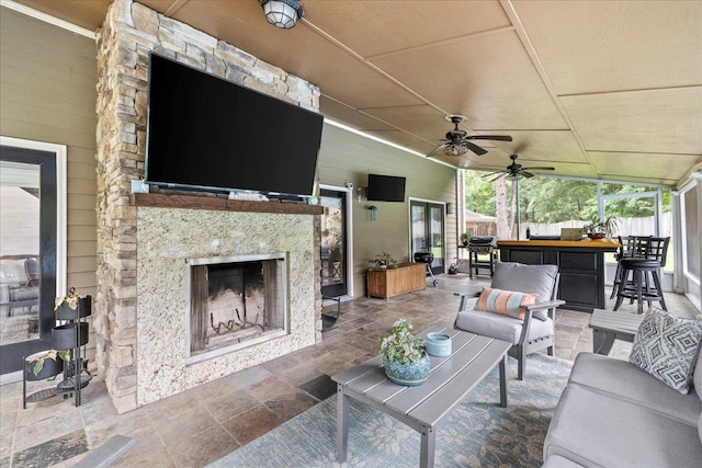 8888 Saltcoates Ct, Tallahassee, FL 32312 - view of patio featuring an outdoor living space with a fireplace and a ceiling fan