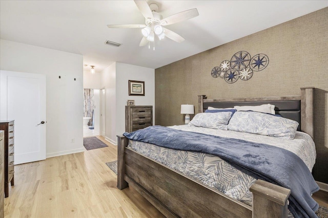 8888 Saltcoates Ct, Tallahassee, FL 32312 - bedroom with wood finished floors, baseboards, wallpapered walls, ceiling fan, and an accent wall