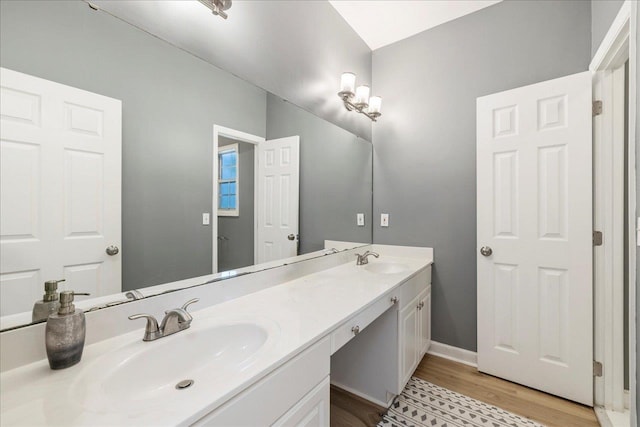 8888 Saltcoates Ct, Tallahassee, FL 32312 - full bathroom featuring double vanity, wood finished floors, and baseboards