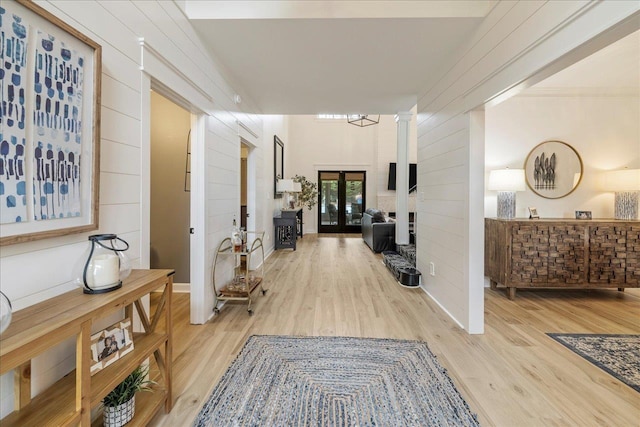 8888 Saltcoates Ct, Tallahassee, FL 32312 - corridor featuring french doors, wood finished floors, and wood walls