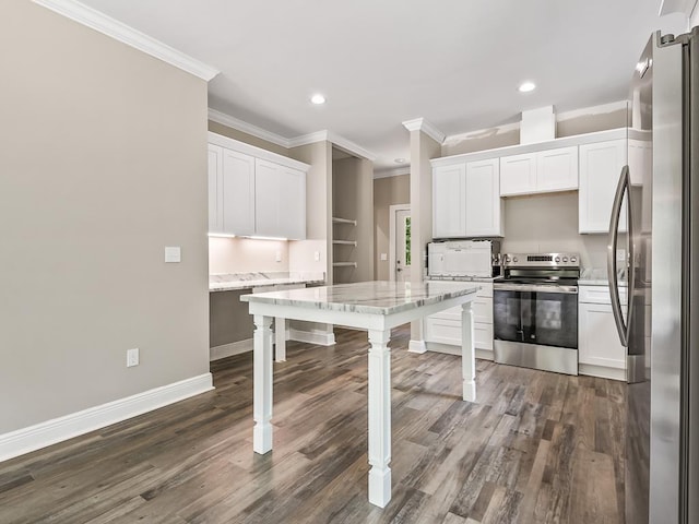 kitchen featuring white cabinets, ornamental molding, stainless steel appliances, and dark wood-type flooring