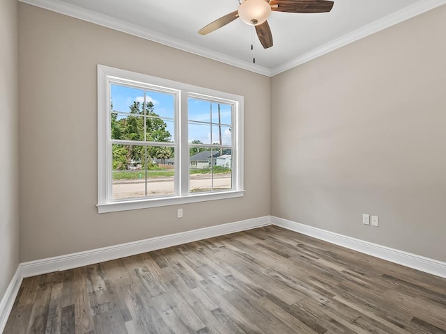 spare room with light wood-type flooring, ceiling fan, and crown molding