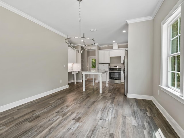 interior space with white cabinets, plenty of natural light, and appliances with stainless steel finishes