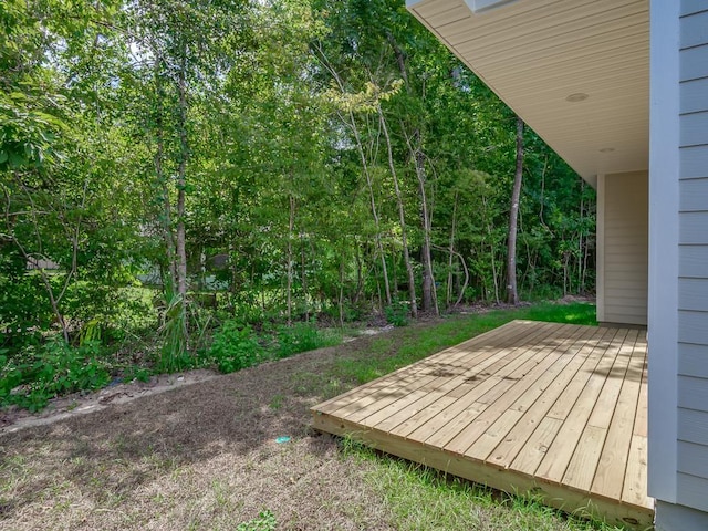 view of yard featuring a wooden deck