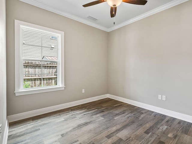 unfurnished room featuring ceiling fan, wood-type flooring, and crown molding