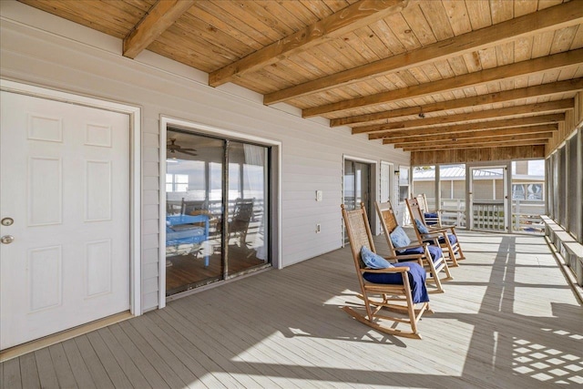 unfurnished sunroom with wood ceiling and beamed ceiling